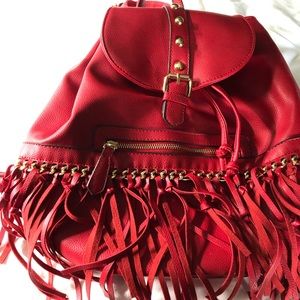 Red-fringed backpack purse